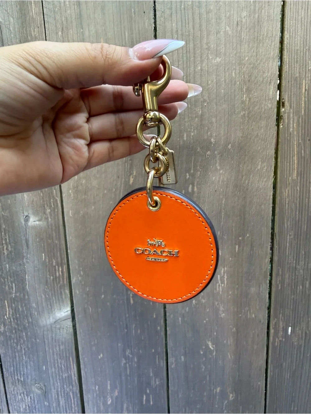 Coach Orange Round Leather Bag Charm with Gold Hardware